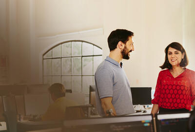 two colleagues talking in the office