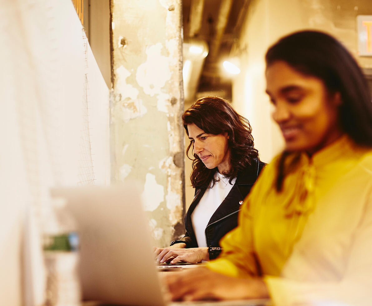 2 women working on a laptop