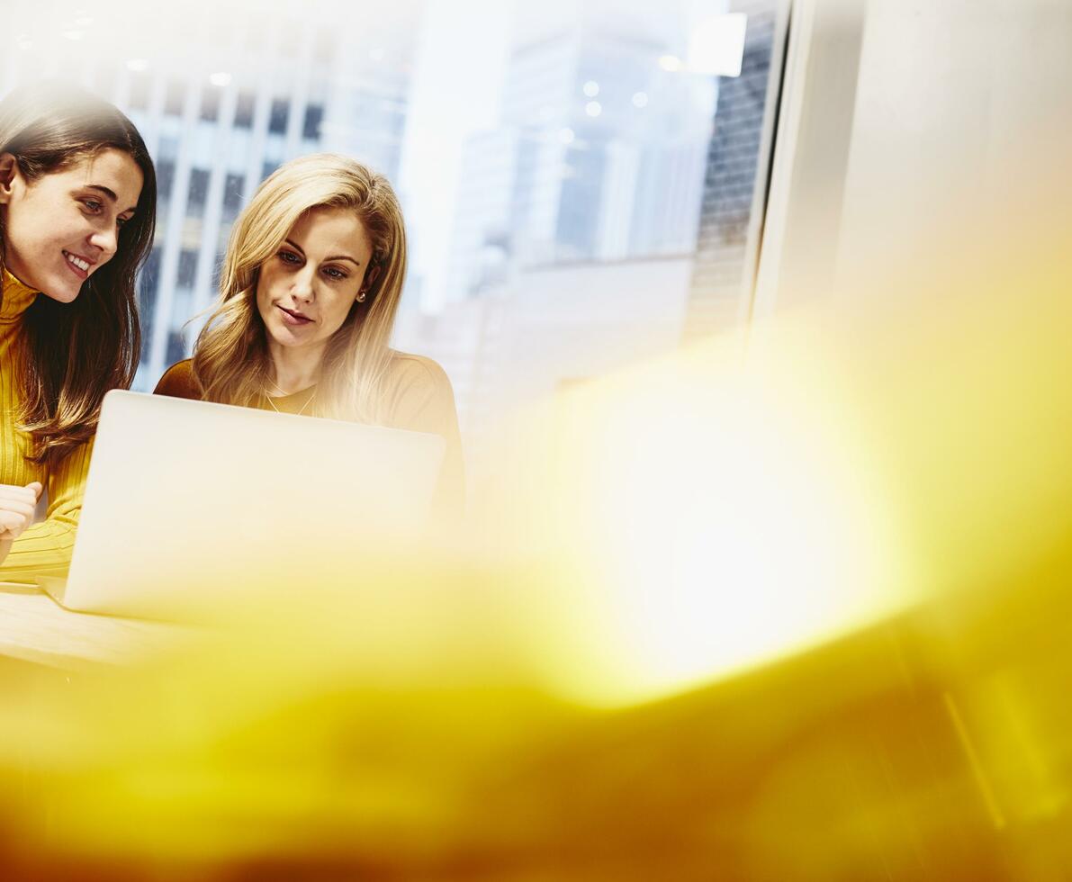 Two women working together