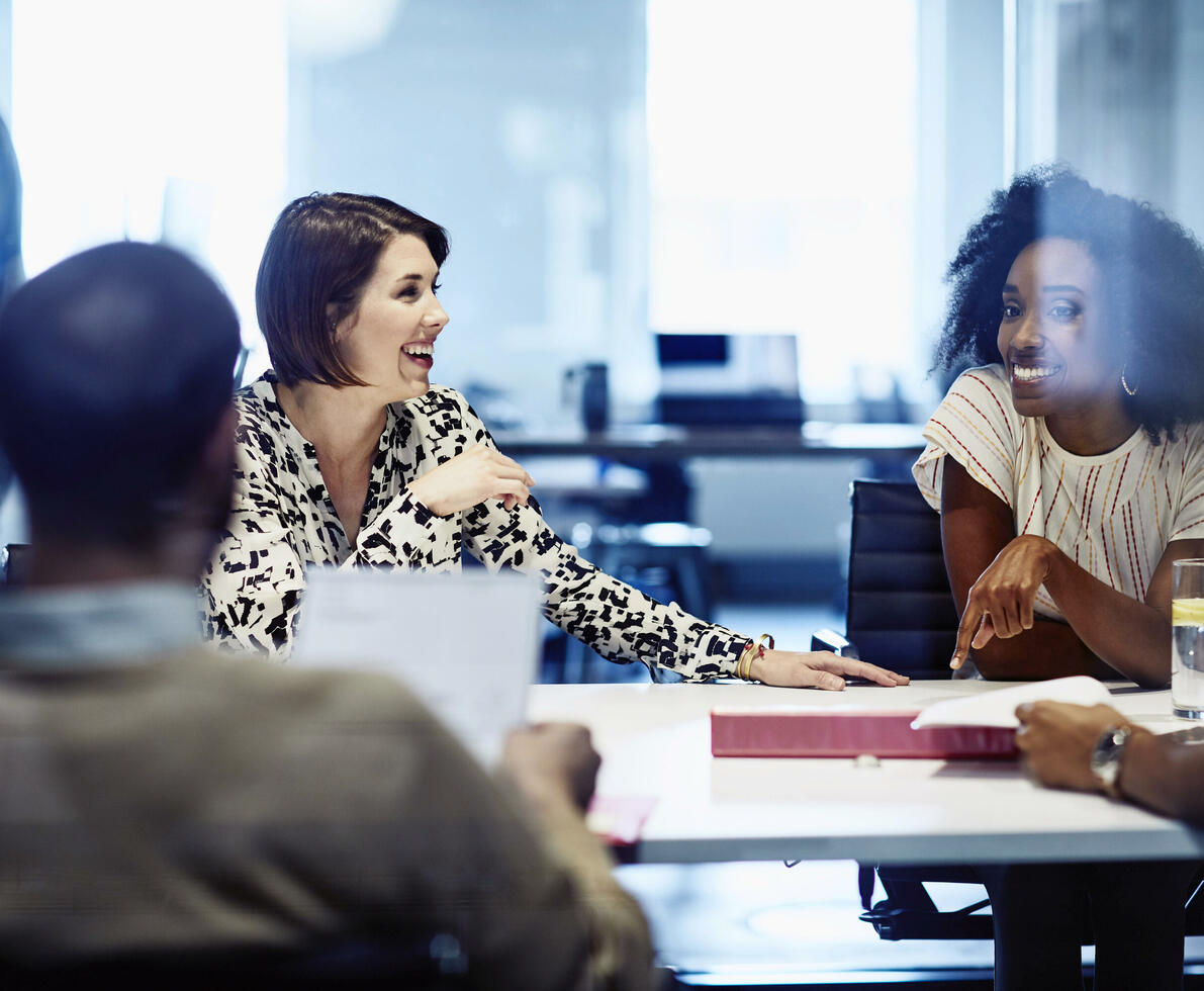 Smiling female in meeting at the office.